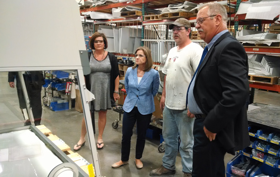 Congresswoman Jenkis examines enclosure