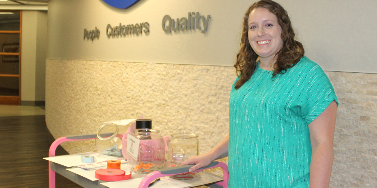 Dealer Marketing Specialist Allison Schach with Cart for the Cure